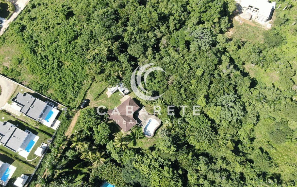 Secluded tropical land parcel with open space and partial shade, perfect for building a luxury home near Cabarete.