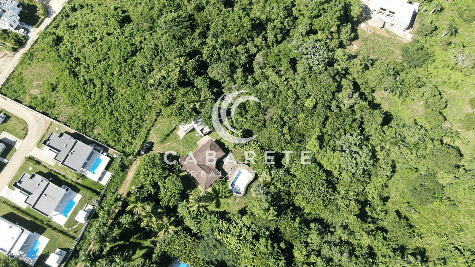 Secluded tropical land parcel with open space and partial shade, perfect for building a luxury home near Cabarete.