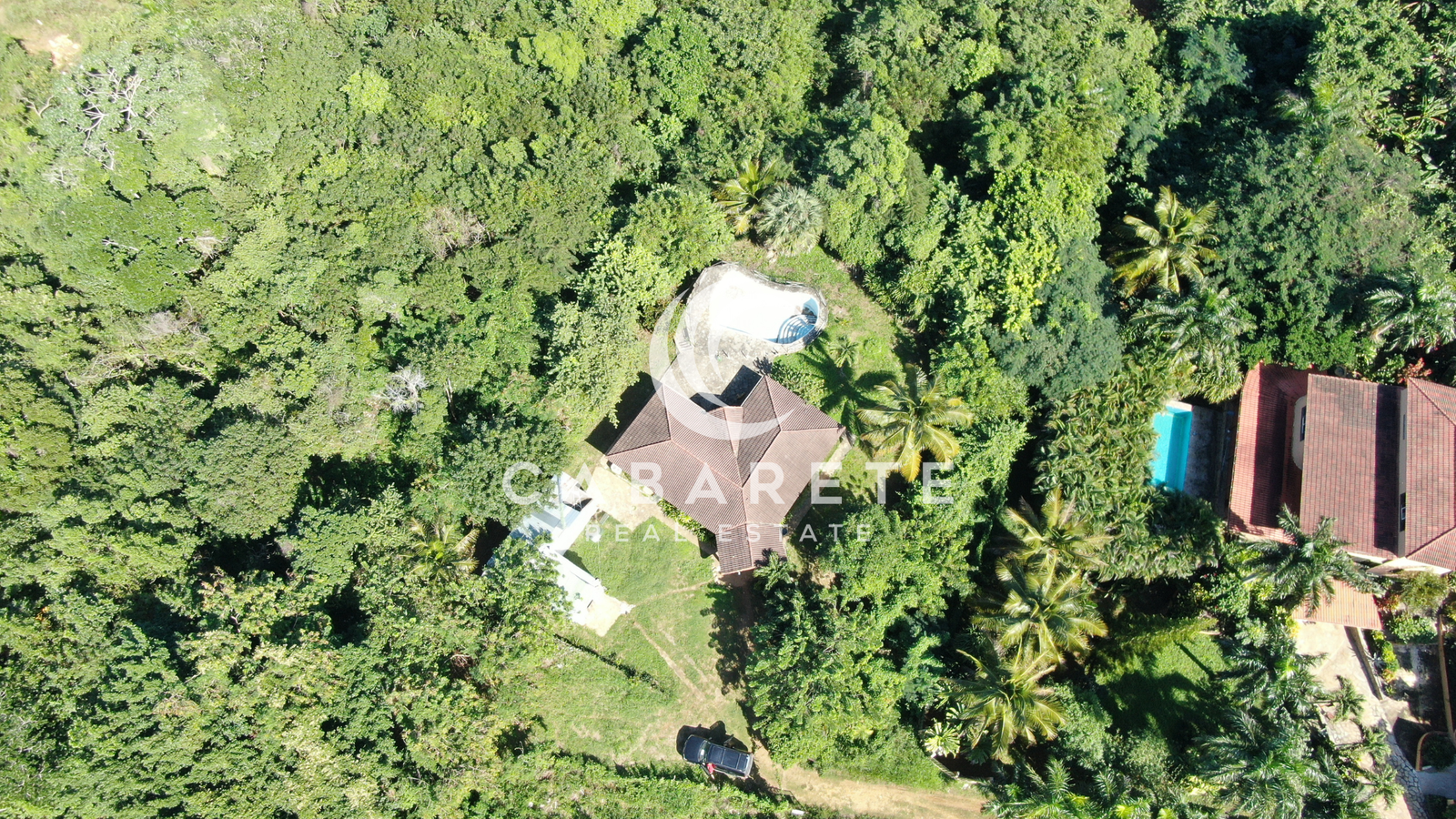 A well-maintained piece of prime land with lush vegetation, located just minutes from the beach in Perla Marina