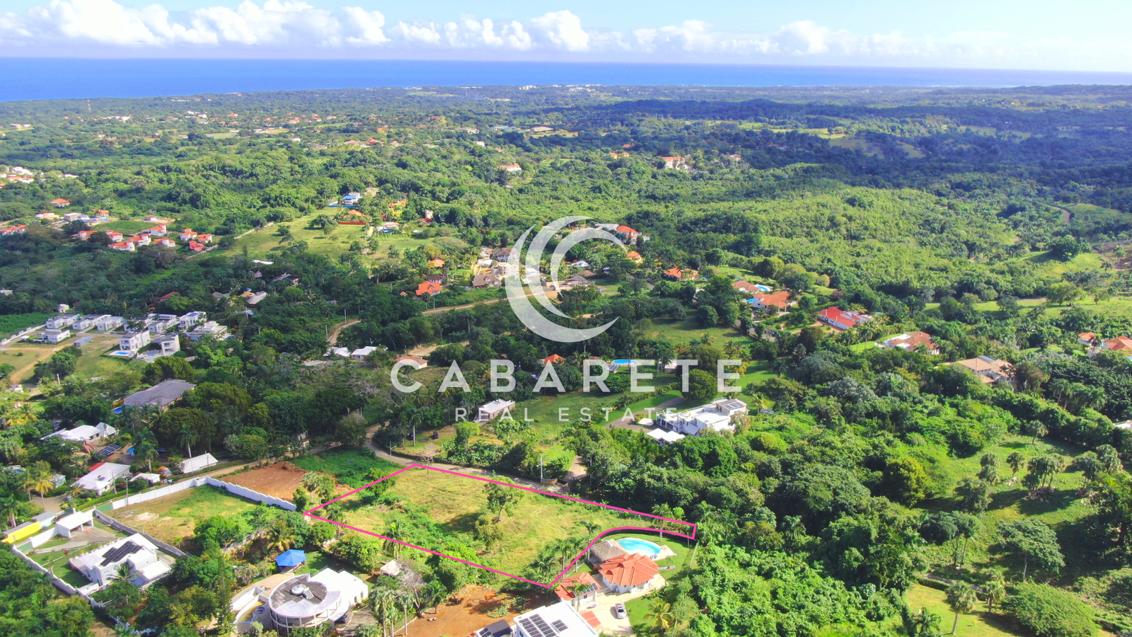 Elevated coastal plot with panoramic views of the Atlantic and lush tropical greenery.
