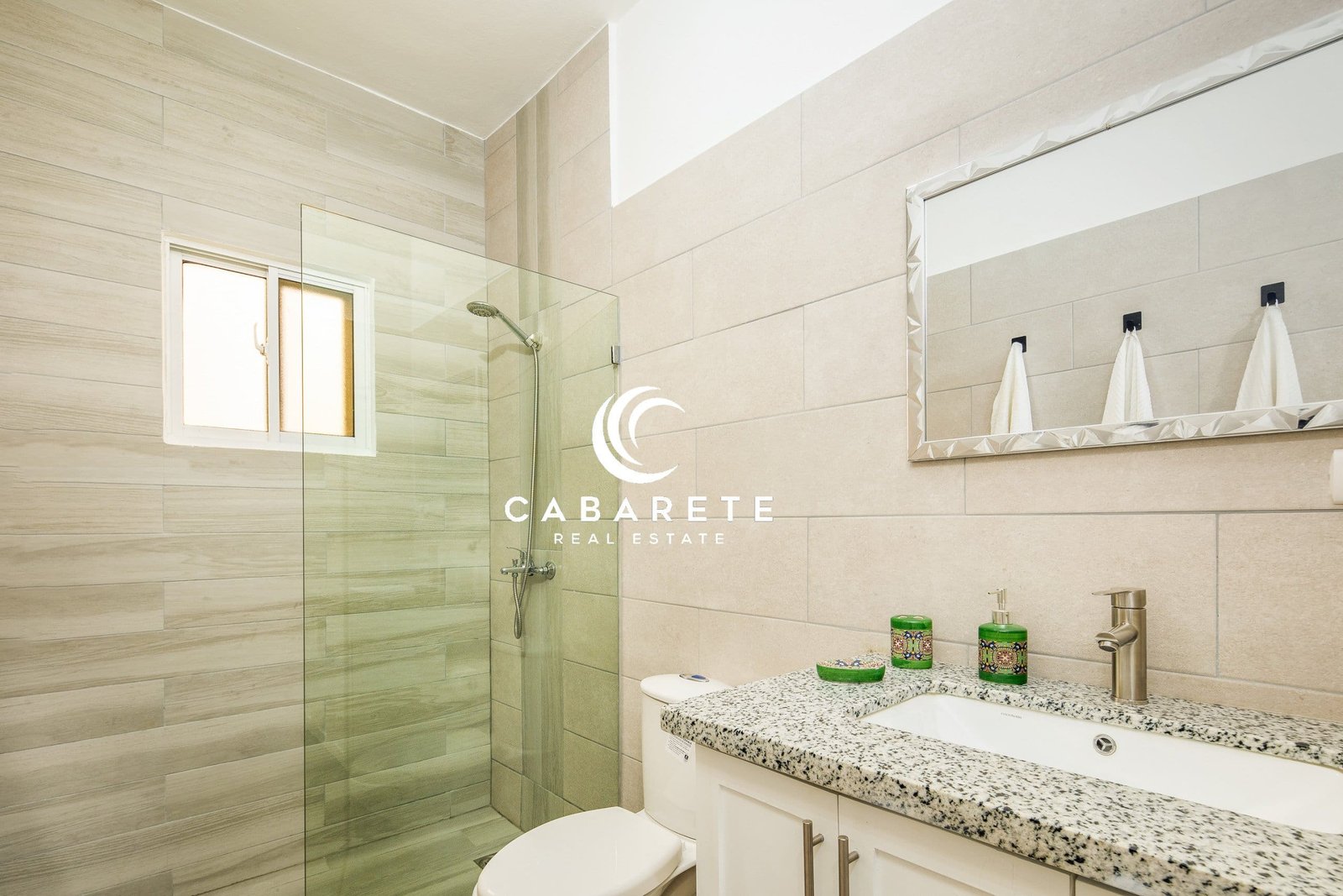 Beautiful 2-bedroom villa featuring a private pool, manicured garden, and covered outdoor lounge area in a secure gated community