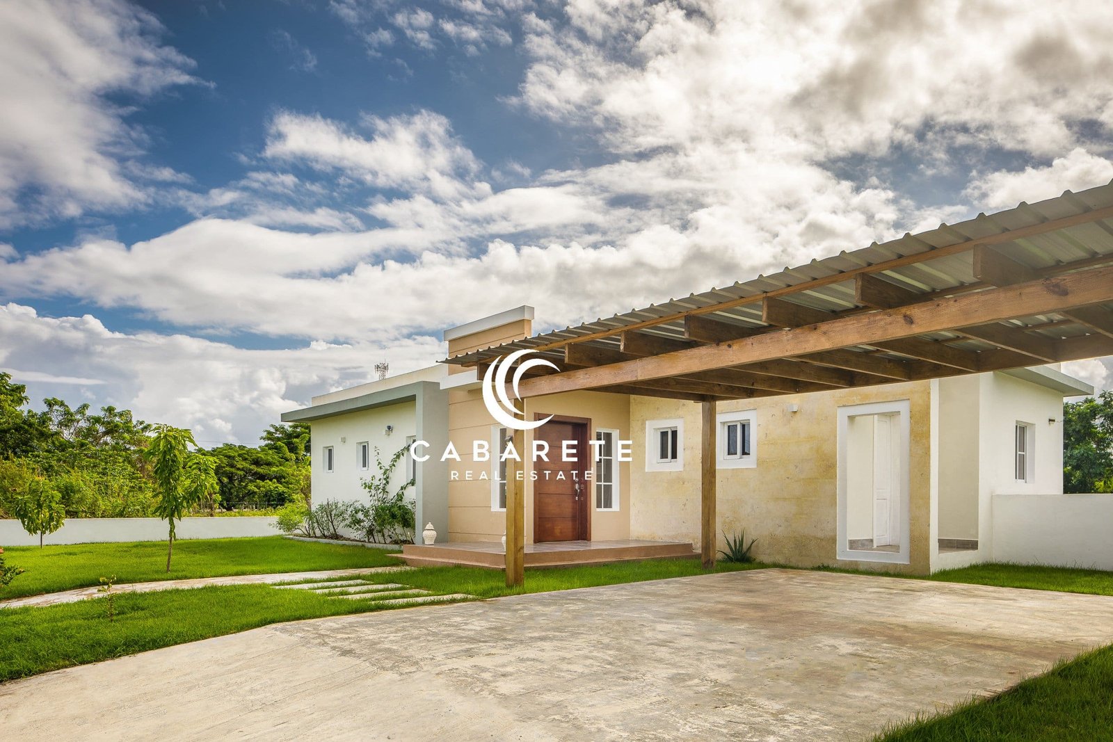 Tropical Dominican villa featuring private pool, manicured garden, and relaxing outdoor terrace just minutes from the beach