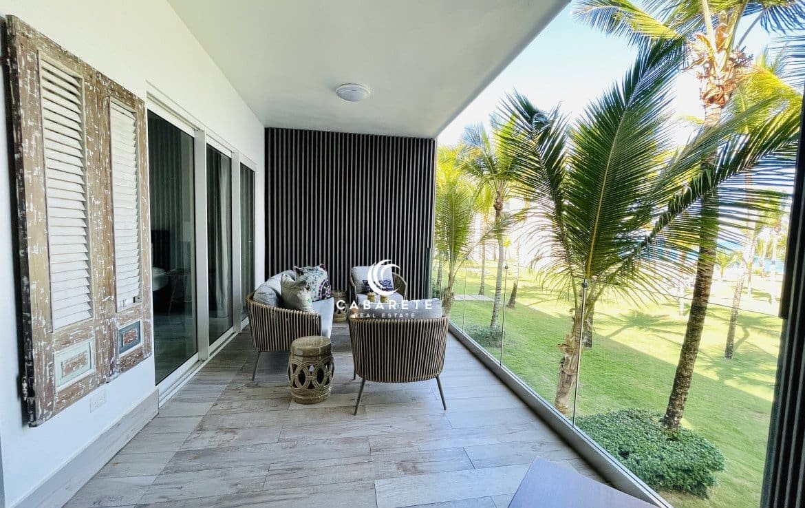 Modern beachfront apartment with three bedrooms, private balcony, and resort-style amenities just steps from the ocean