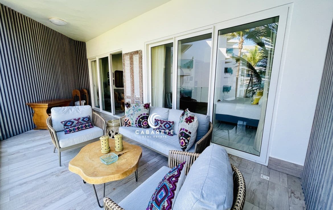 Stylish second-floor apartment with ocean breeze, modern interiors, and direct beach proximity in a secure gated community