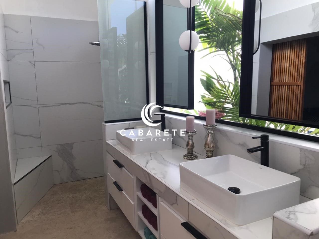 Luxury Villa for Salesosua ocean village Furnished 3-bedroom villa in Sosua, Dominican Republic, featuring an open-concept living area and tropical garden.