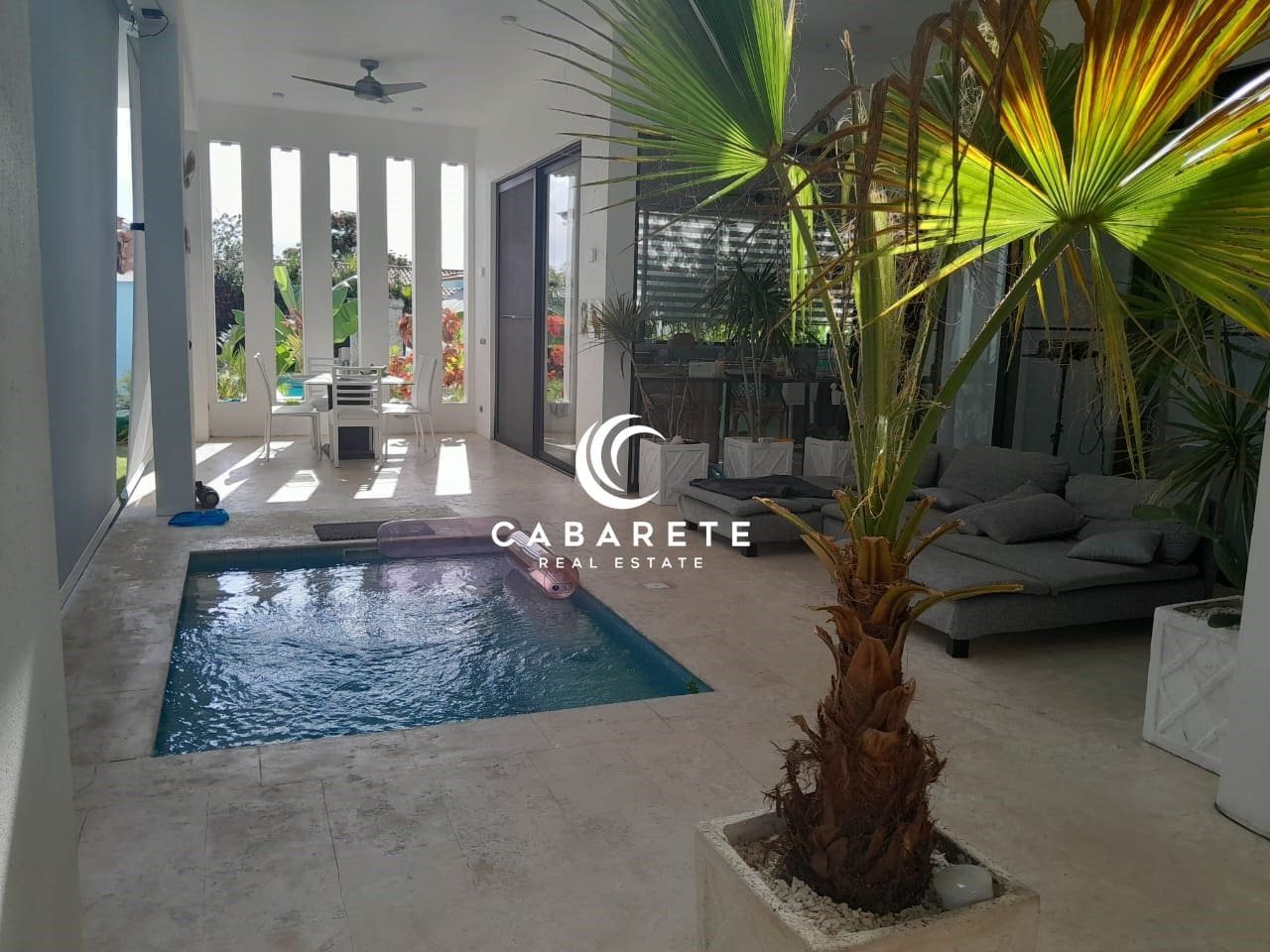 Caribbean villa with a private pool in Sosua Ocean Village, Dominican Republic, surrounded by tropical landscaping.