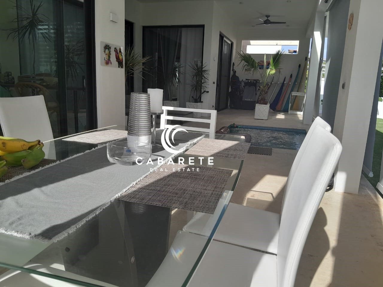 modern villa sosua near beach for sale Furnished 3-bedroom villa in Sosua, Dominican Republic, featuring an open-concept living area and tropical garden.
