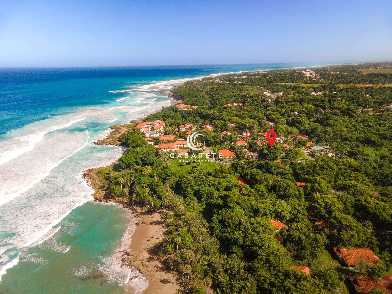 beachside prime land for sale perla marina dominican republic Alt Text: Prime Land for Sale in Perla Marina, Dominican Republic – A 1,029 m² lot in a gated community near the beach, surrounded by tropical nature and luxury homes.