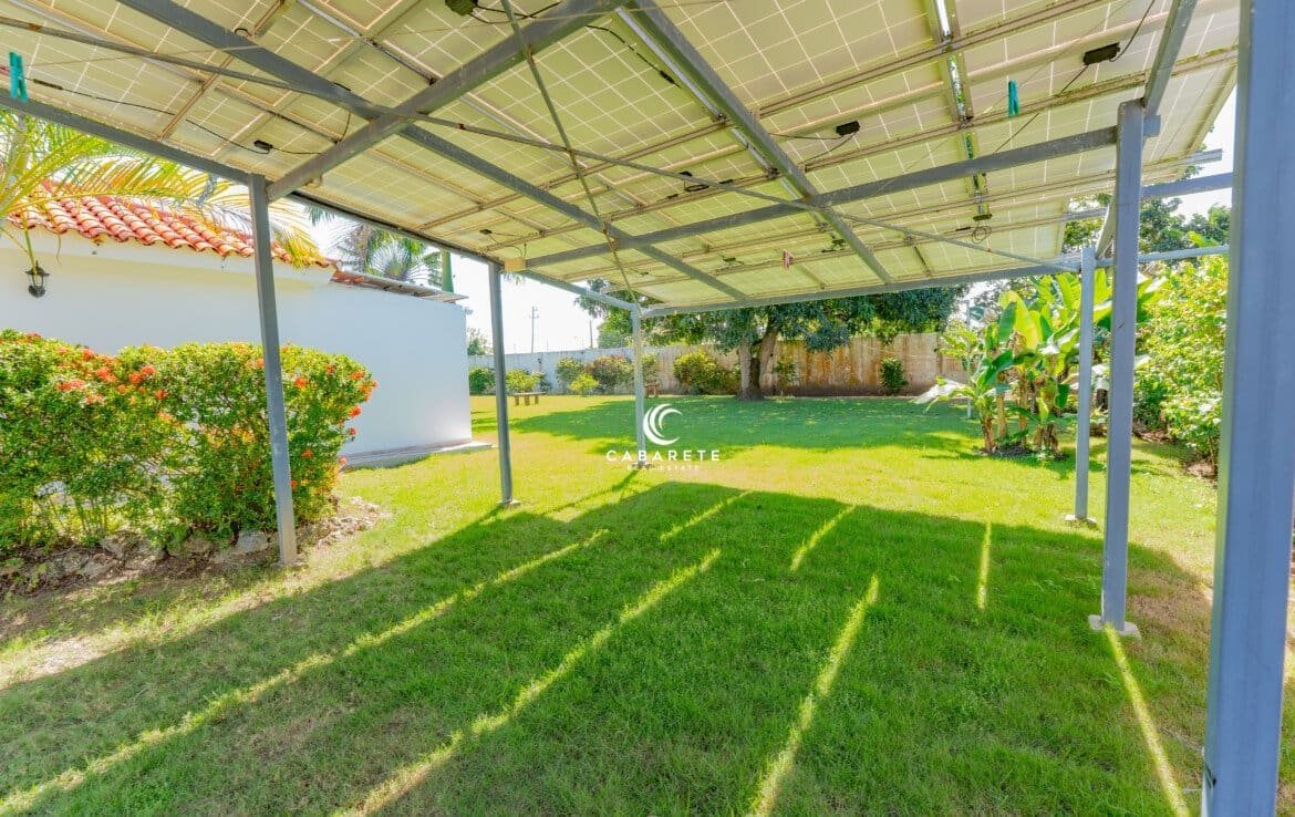 Spacious open-plan living area with vaulted ceilings and seamless indoor-outdoor flow. #OpenConceptVilla #TropicalInteriors #CabareteHomes