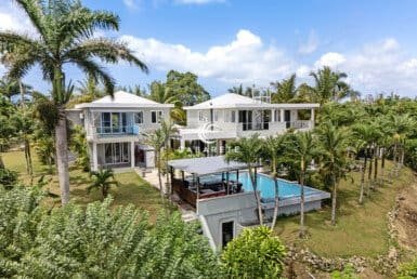 A private estate for sale in the Dominican Republic featuring panoramic 360° views of the ocean and mountains.
