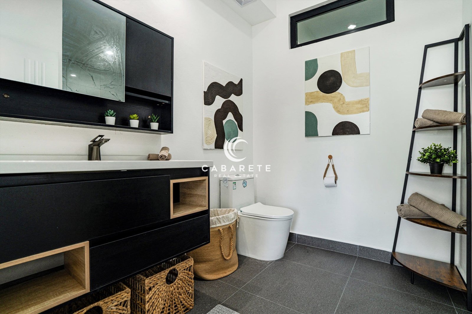 Modern bathroom in a Cabarete condo for sale with marble-style tiles