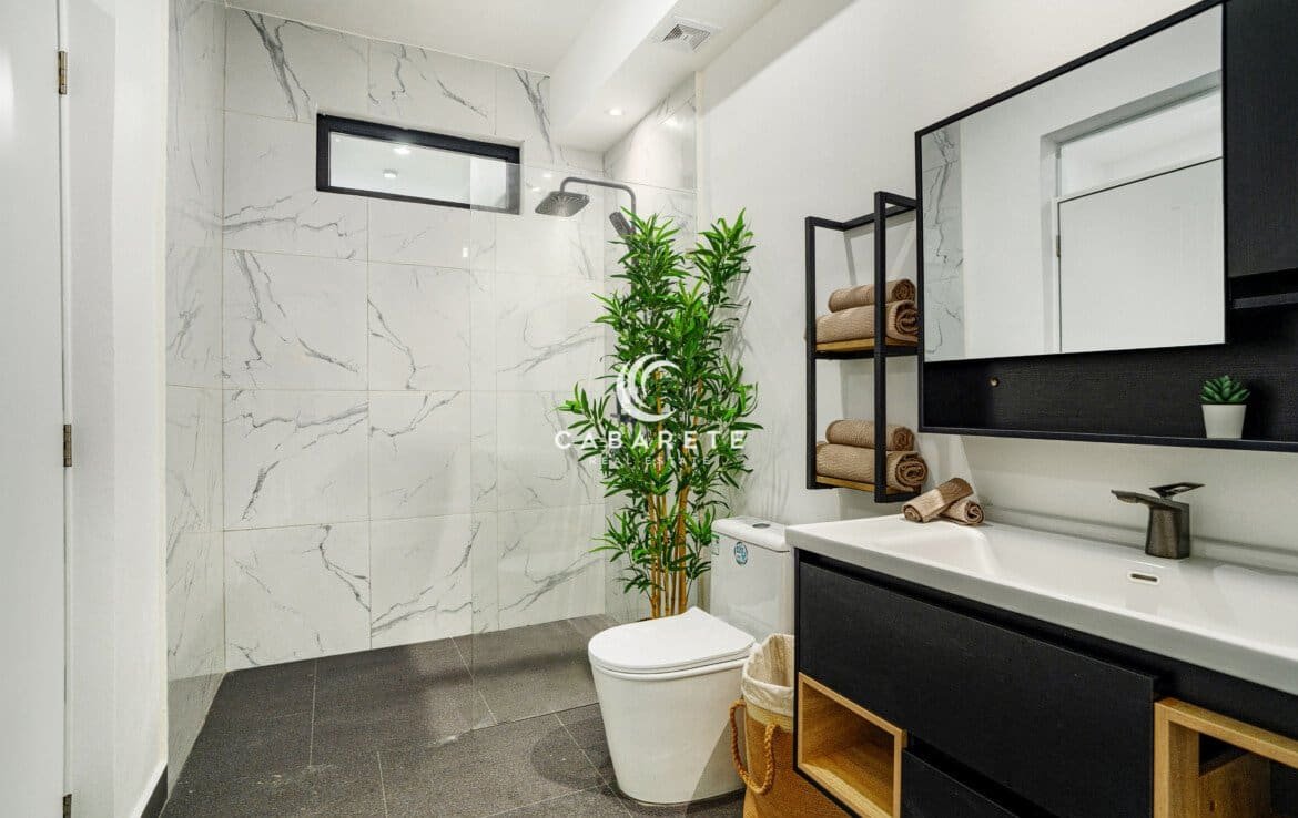 Master bedroom in a Cabarete two-bedroom condo for sale with calming views