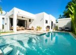 modern white house backyard patio pool lounge grill