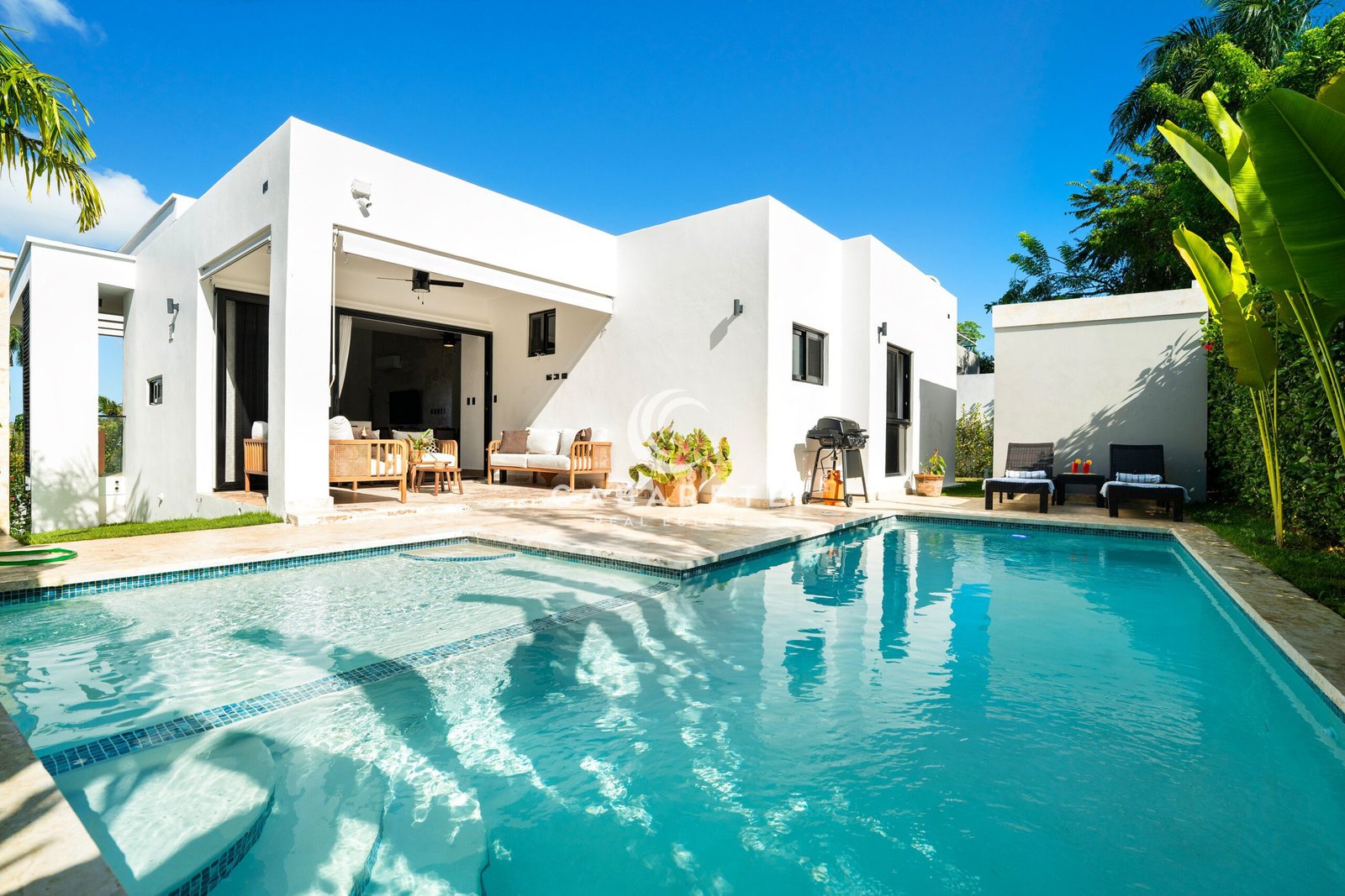 modern white house backyard patio pool lounge grill
