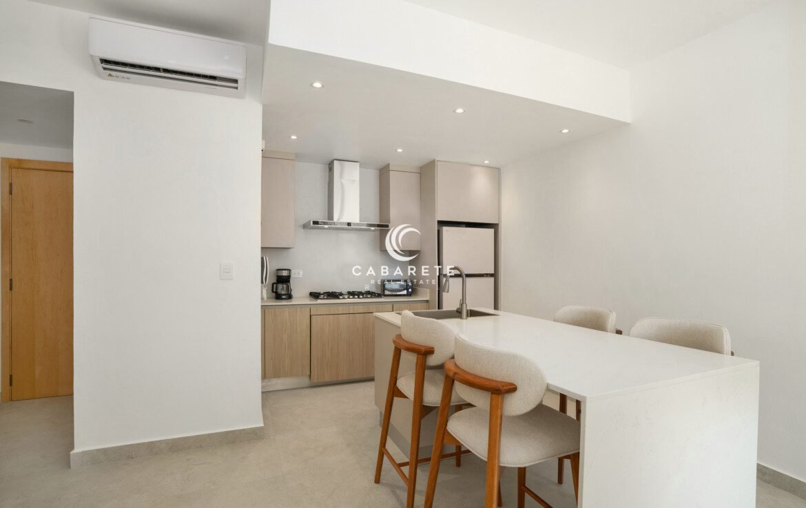 Open-concept kitchen with island dining at Mareal