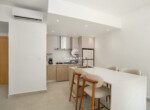 Open-concept kitchen with island dining at Mareal