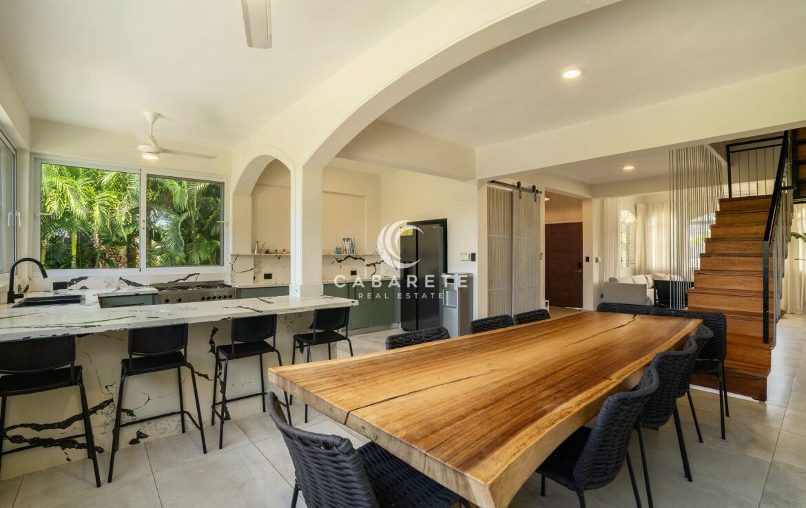 Indoor dining area in tropical gated community villa