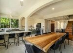 Indoor dining area in tropical gated community villa