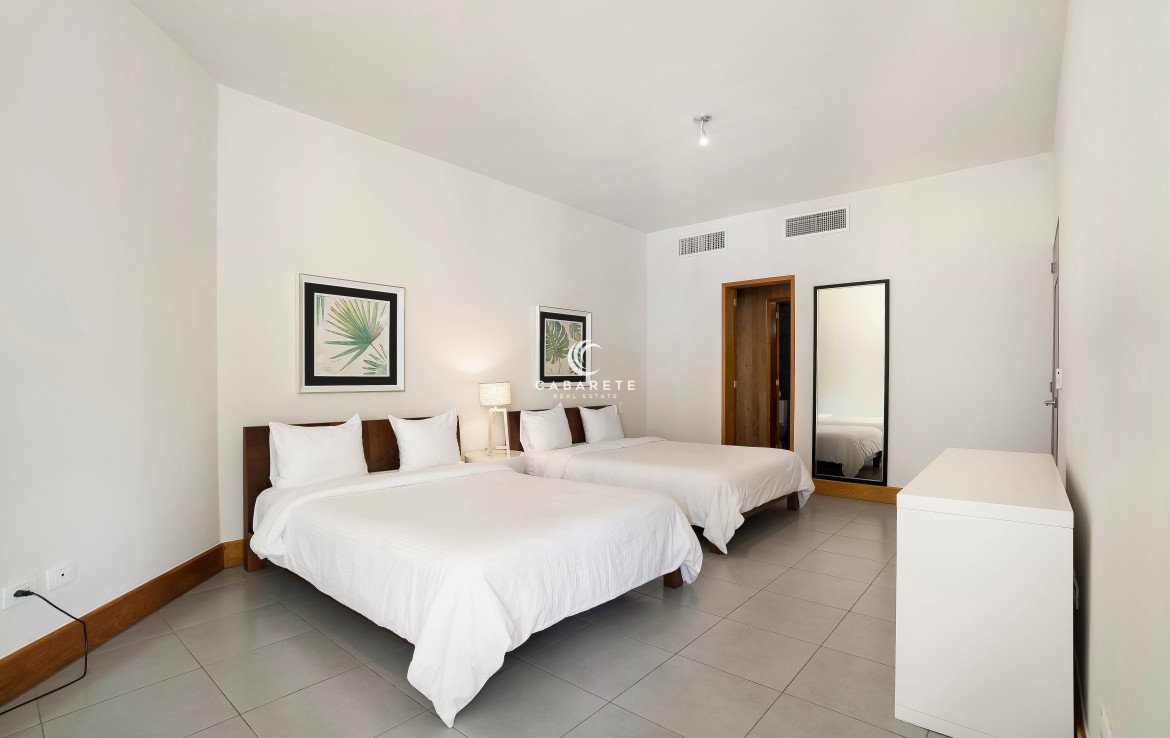 Guest bedroom with ocean views in luxury beachfront residence