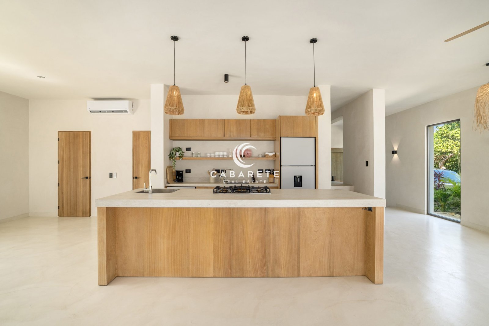 Contemporary kitchen with large island in luxury Cabarete villa