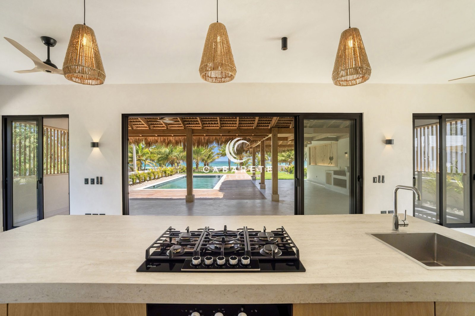 Contemporary kitchen with large island in luxury Cabarete villa