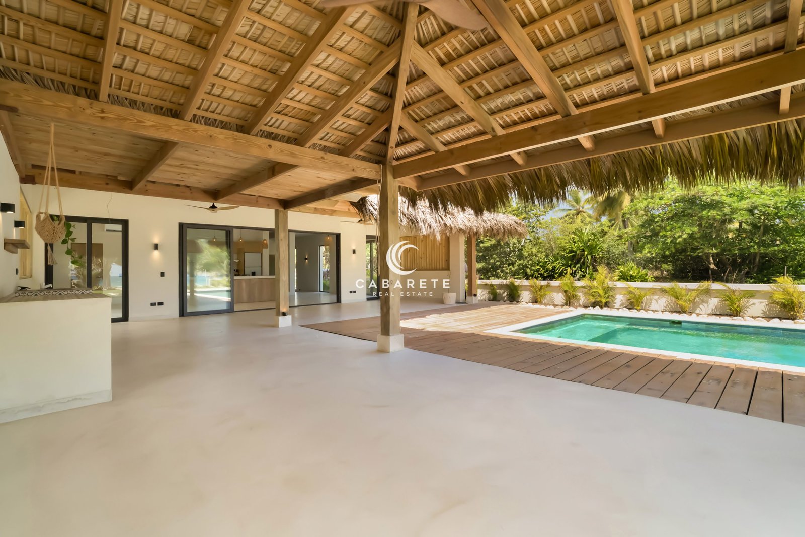 Luxury villa living area opening to private pool and terrace