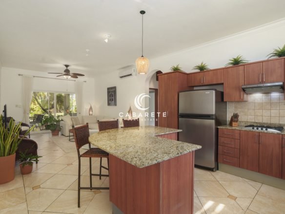 Fully equipped kitchen with granite peninsula in Ocean Dream Cabarete condo