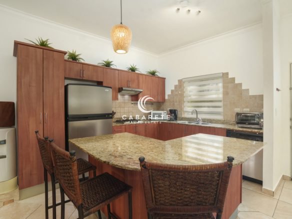 Open kitchen with granite countertops in 2-bedroom Ocean Dream condo