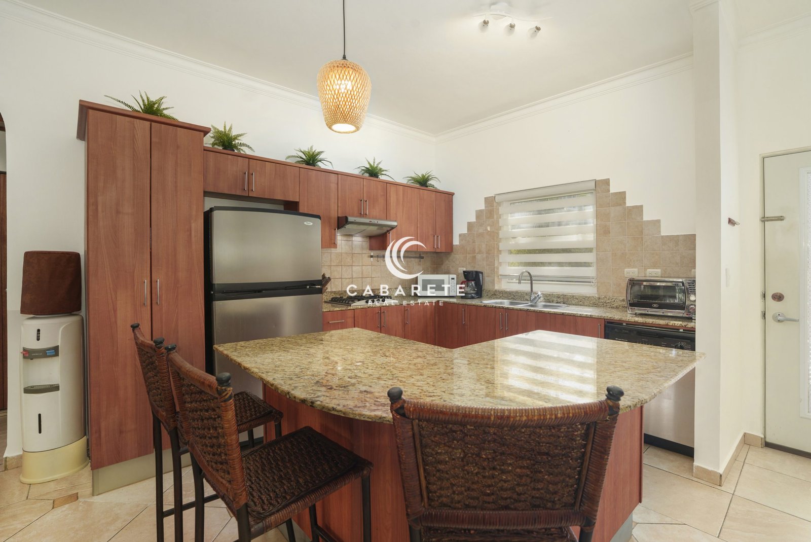 Open kitchen with granite countertops in 2-bedroom Ocean Dream condo
